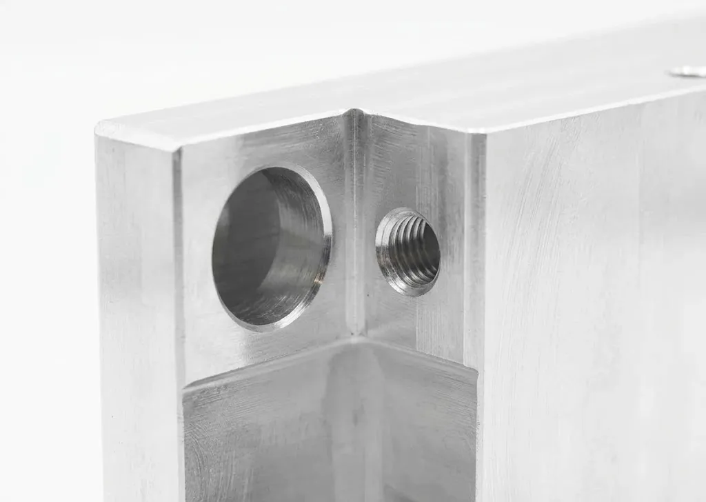 Deep cavity side hole drilling and tapped thread details on aluminum enclosure by FIWOK METALWORKS